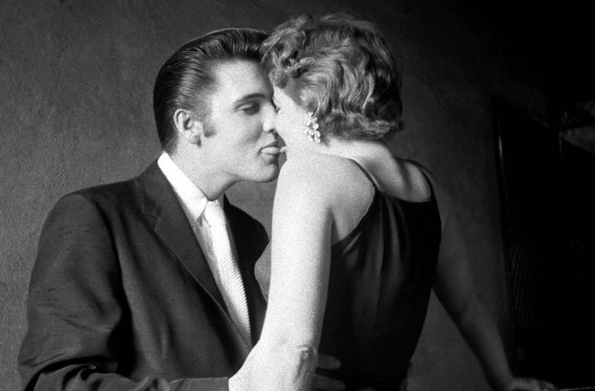 "The Kiss," shows Elvis Presley and Barbara Gray in an intimate clinch. For more than five decades, no one knew who Gray was. "People were looking for a tall woman," she says today. "But, actually, I was standing on a step above him."