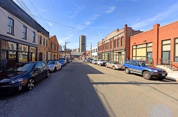 The view in Shockoe Bottom on East Franklin Street looking east toward the high rise Monroe Building. The historic and tight street grid here suggest how the district should be developed. - SCOTT ELMQUIST