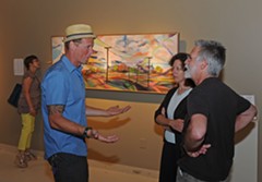 Trask talks to patrons at the opening of his show Friday at Glave Kocen Gallery. - ASH DANIEL