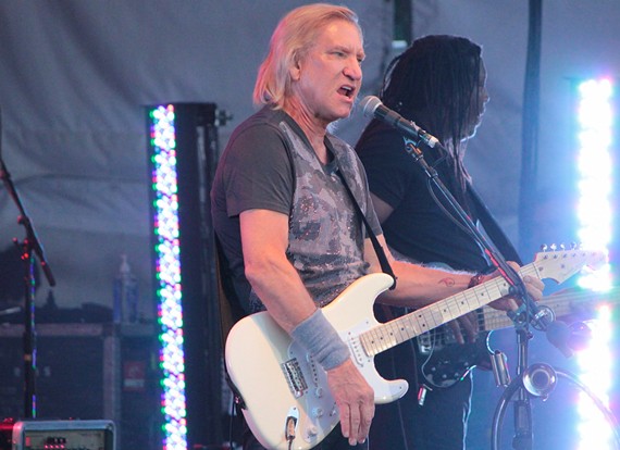 After granting media passes, Joe Walsh's people changed their mind and wouldn't let local media near the photo pit, so this photo was taken from a distance away during his Innsbrook performance. - BRENT BALDWIN