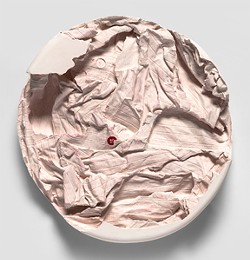 Jessica Heikes, “Dissipated,” 2017, plaster, lint, button