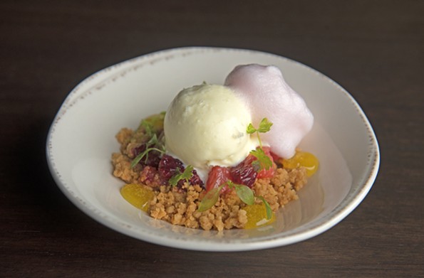 Olive oil crumble with winter citrus topped with herbs, olive oil ice cream and citrus foam. - SCOTT ELMQUIST