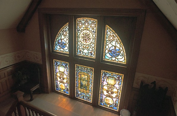 Above the grand staircase from the living hall is a two-part, 15-foot stained glass window by Tiffany Glass and Decorating Co. It was installed in 1892. - SCOTT ELMQUIST