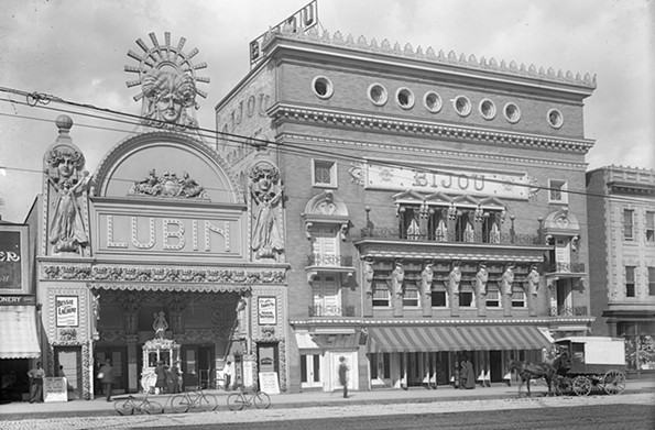 This early 20th century photograph captured bicycles and a horse-drawn wagon in front of the Lubin and Bijou theaters in the 800 block of East Broad Street. The Lubin opened in 1909 as a vaudeville house and nickelodeon. The Library of Virginia now occupies the site. - THE VALENTINE