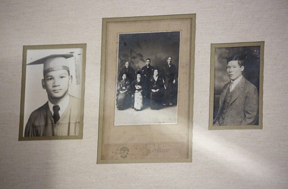 Family photographs in Regina H. Boone’s Richmond home feature her father, Raymond H. Boone, at left, and her grandfather, Tsuruju Miyazaki, at right. The middle photograph is a family portrait from the wedding of Miyazaki’s sister. Raymond was 3 when Miyazaki was arrested in Suffolk on Dec. 7, 1941, and taken away. - KAITLIN MCKEOWN