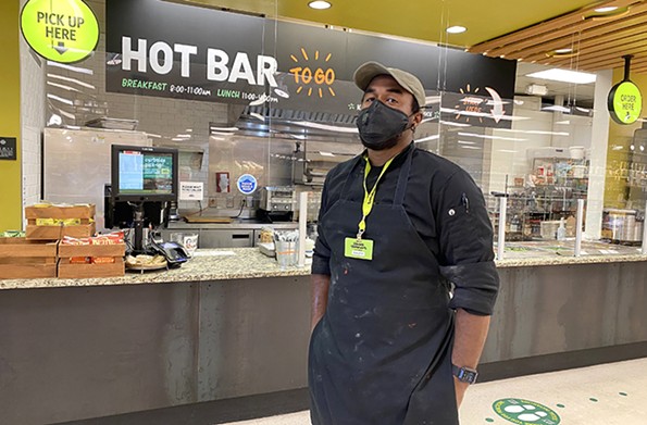Xavier Beverly, Ellwood Thompson’s new kitchen manager, is staying positive during the pandemic and channeling his energy into serving the community. - SCOTT ELMQUIST