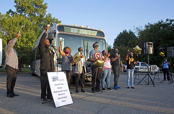 Candles are held in October in remembrance of John Thrower, a 49-year-old GRTC Transit System driver who died from complications caused by the coronavirus Sept. 23. - SCOTT ELMQUIST/FILE