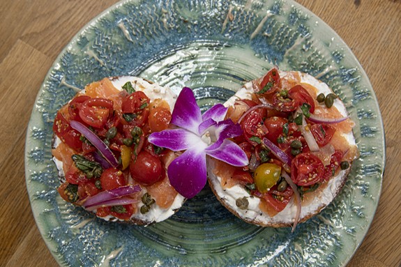 Bagel Chewys with rosemary sea salt, smoked salmon, cherry tomato salad, capers and cream cheese.  - SCOTT ELMQUIST