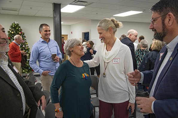Karen Stanley greets well-wishers at a recent open house bon voyage for her retirement.