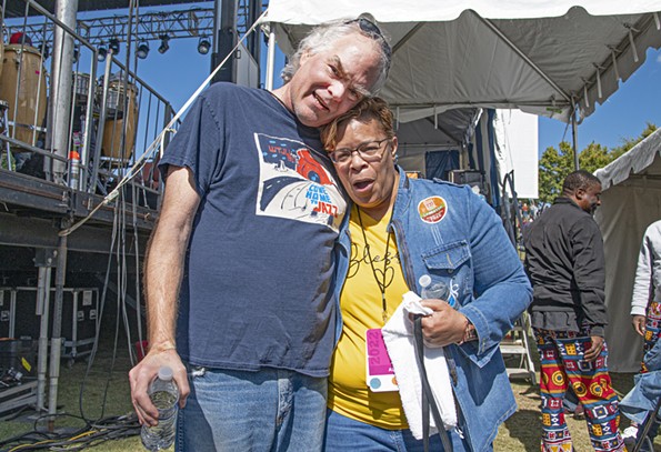 Don Harrison, volunteer member of the Richmond Folk Festival programming board, and first time musical artist, lap-steel guitarist Fran Grace, at the 2022 festival. - SCOTT ELMQUIST
