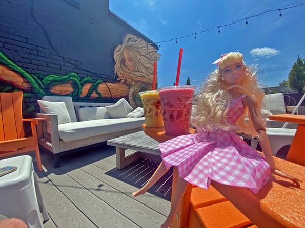 Barbie chilling at The Pit and the Peel rooftop with some refreshing summer smoothies. - SCOTT ELMQUIST