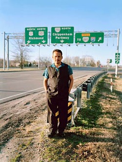 In a photo by Steven Casanova, Federico Xol stands near the spot where he first got off a bus in Richmond to meet his brother, following a perilous journey from Central America