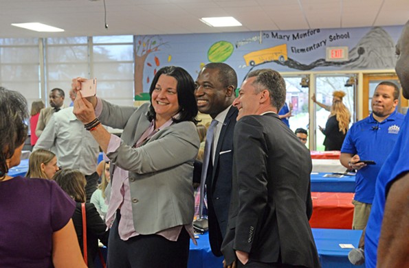 Kamras takes time for a selfie with Mayor Levar Stoney before addressing a crowd at Mary Munford Elementary School. - SCOTT ELMQUIST