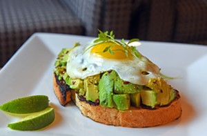 At the Graduate Richmond, a sunny-side-up egg tops chunky, salty avocado on a buttery slice of toast. - SCOTT ELMQUIST