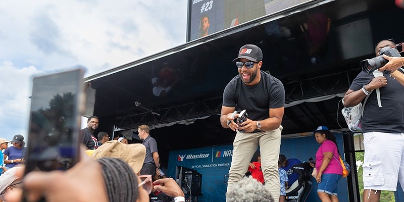 NASCAR star driver Bubba Wallace greets fans at Richmond Raceway in 2022.