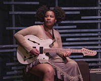 Cast member Jaylin Brown performs on electric guitar in "Ghost Quartet" at Firehouse.