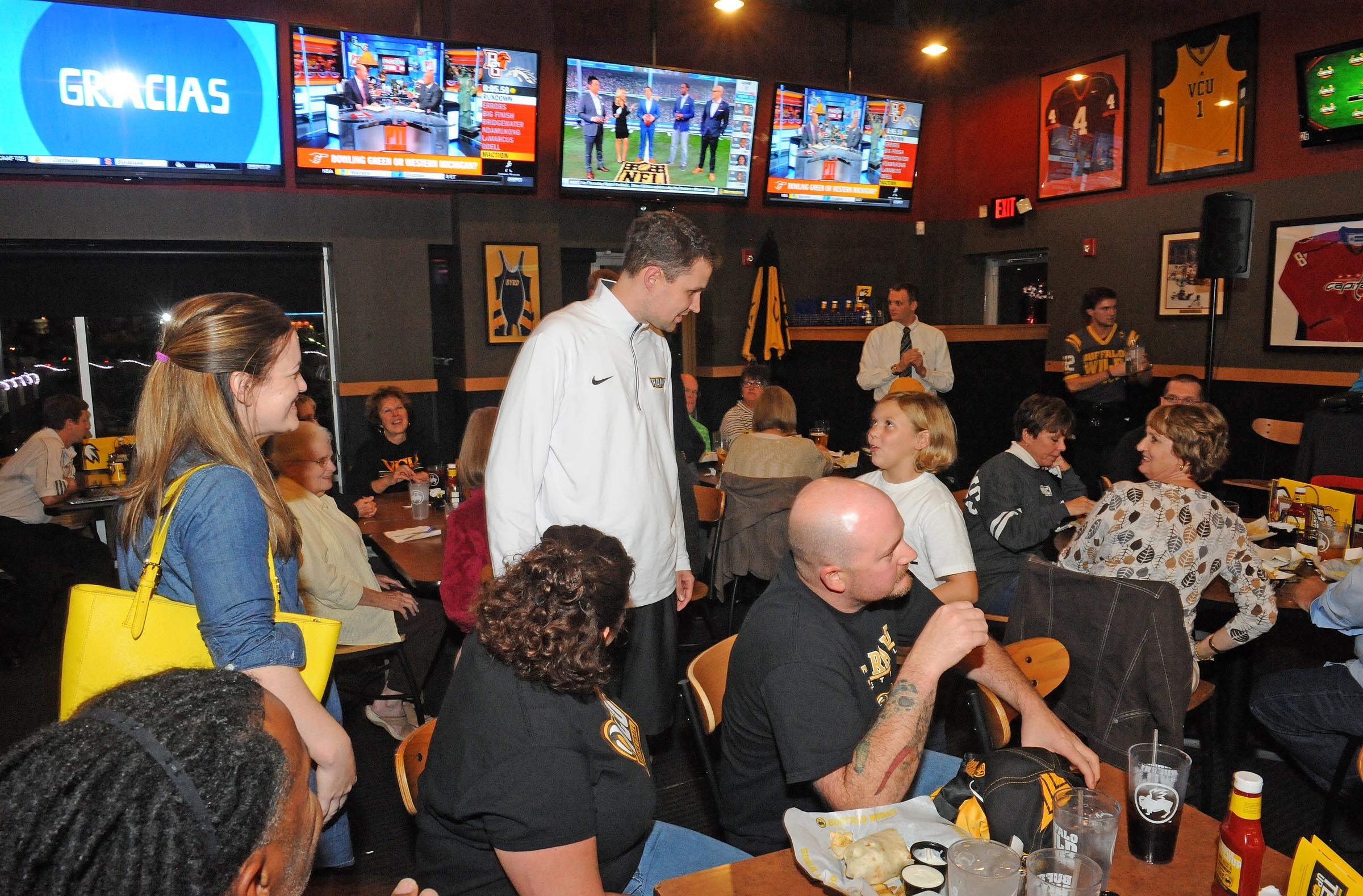 Wade meets with fans and well-wishers at the Buffalo Wild Wings last month in Short Pump before a taping of his coach’s show, which airs on ESPN-AM 950. - SCOTT ELMQUIST