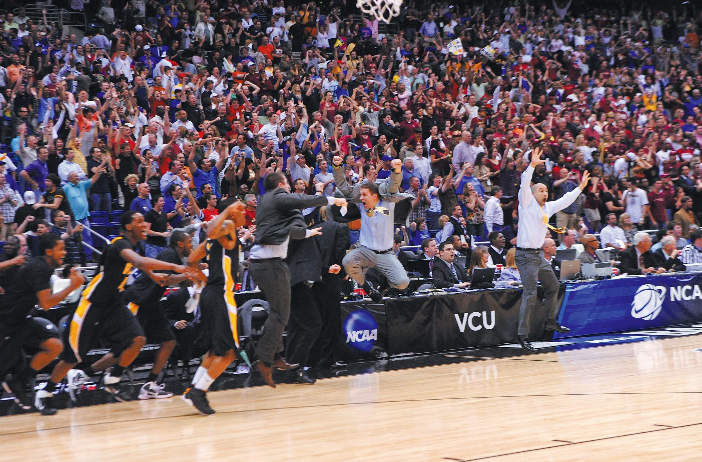 Wade celebrates during his tenure as assistant coach with the Rams, after a win over Kansas sent the team to the Final Four in 2011. - SCOTT ELMQUIST
