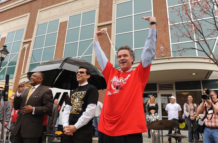 University of Richmond President Ed Ayers, right, goes for a roof-raising cheer beside Virginia Commonwealth University President Michael Rao. Mayor Dwight Jones speaks at the rally held at the Turning Basin before the Rams and Spiders headed for San Antonio. - SCOTT ELMQUIST