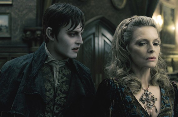 "You're dead to me." Johnny Depp and Michelle Pfeiffer share a mutual disdain for garlic and sunshine in Tim Burton's hilarious re-take of the vampire soap opera, "Dark Shadows." - PETER MOUNTAIN