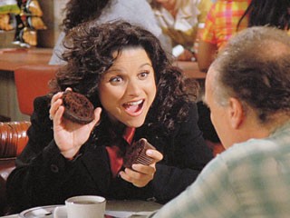 Elaine gets kicked out her building for putting Canadian quarters in the washing machine.