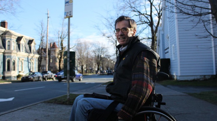 Gerry Post waits at a bus stop at the corner of Inglis and South Park.