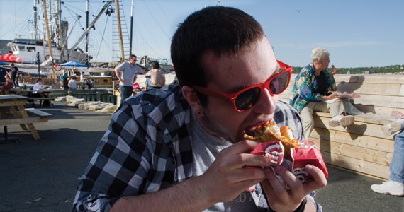 He’s eating fish wrapped in a BeaverTail. - COURTNEY KELSEY