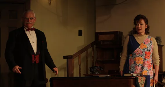 Monkswell Manor hostess Mollie (Bonnie Matthews) and the unexpected guest Mister Paravicini (Miles Leahy).