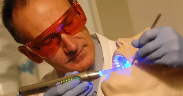 Richard Price demonstrates his Measurement of Accuracy when Resin Curing (MARC) system. Price is named by the Class of DDS 2015 Gentlemen Facebook group as under scrutiny for sexual harassment. - DALHOUSIE