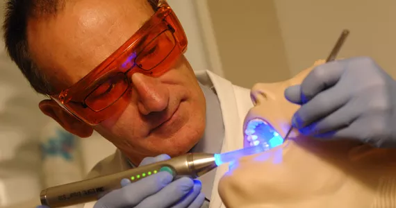 Richard Price demonstrates his Measurement of Accuracy when Resin Curing (MARC) system. Price is named by the Class of DDS 2015 Gentlemen Facebook group as under scrutiny for sexual harassment. - DALHOUSIE