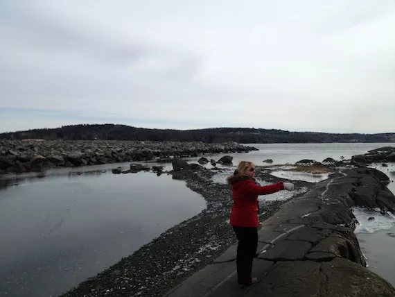 Sandra Banfield points at the Bedford Reef. Behind her, to the left, is the infilling project.