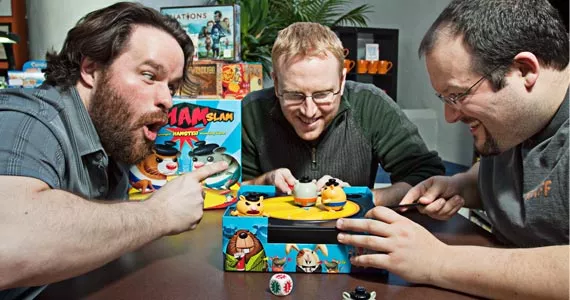 Things get heated with (l-r) Jon-Paul Decosse, Kris Moulton and John Gallant of the Board Room Game Cafe. - LENNY MULLINS