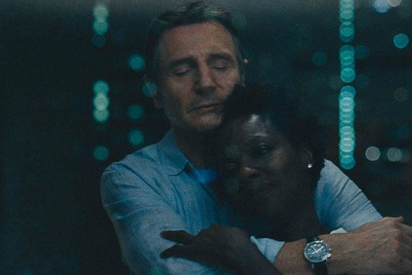 Neeson and Davis share a rare moment of levity in Widows. - SUBMITTED