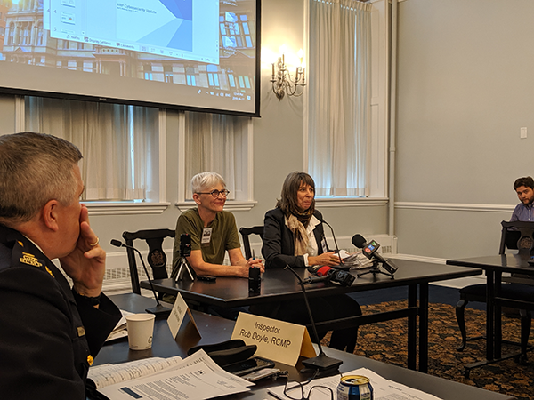 Joanne Bealy and Nancy Hunter (right) present The Coalition to Ban Street Checks’ petition for the province to Halifax’s Board of Police Commissioners. - SUBMITTED
