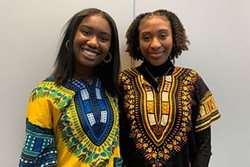 Amariah Bernard (left) and Zamani Millar sang a moving rendition of “O Canada” and “Lift Every Voice and Sing” in front of the crowd. - THE COAST