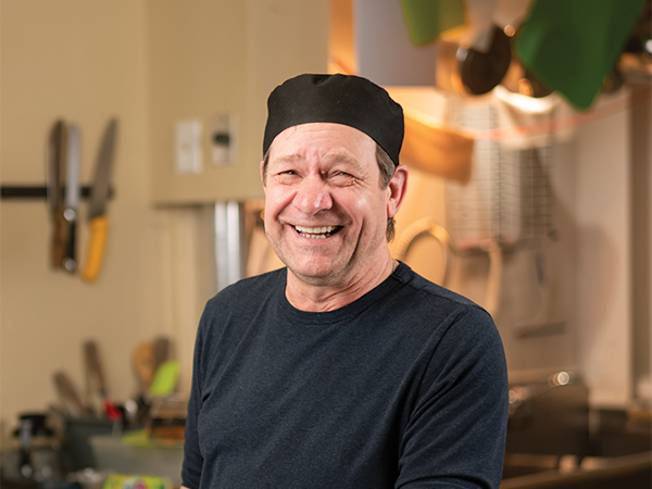 Eldon Turner serves turkey dinner, and good company