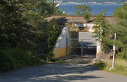 Don't be deceived, this rail bridge will soon lead you to a boozy outdoor oasis. - GOOGLE MAPS