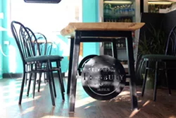 Finsbury's logo custom-made into the legs of a table in their brand new seating area. - VICTORIA WALTON