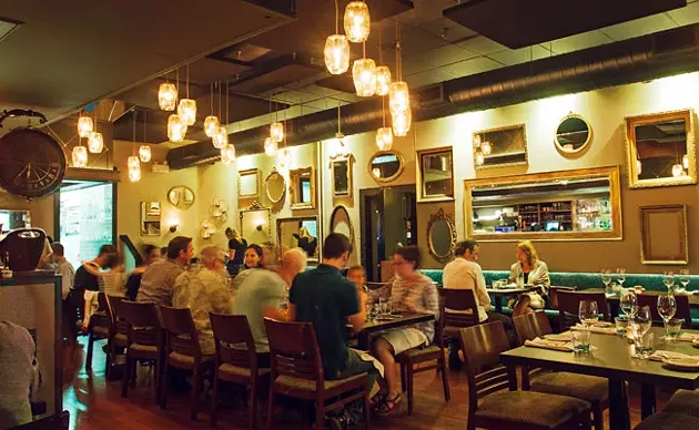 Chives Bistro's latest renovation before it closed saw antique mirrors cover the walls. - LENNY MULLINS
