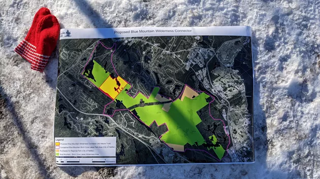 A map of the Blue Mountain Birch Cove Wilderness area hangs out by a trail inside the Blue Mountain Birch Cove Wilderness area. - CAORA MCKENNA