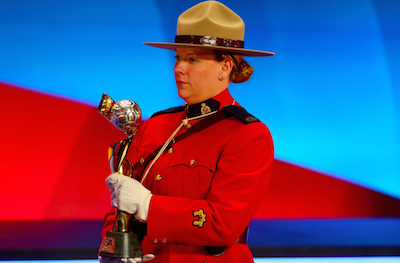 The FIFA Woman`s World Cup trophy is carried by an RCMP officer during an event last year in Ottawa. Mountie at the draw in Ottawa. - ALEXANDER HASSENSTEIN, FIFA