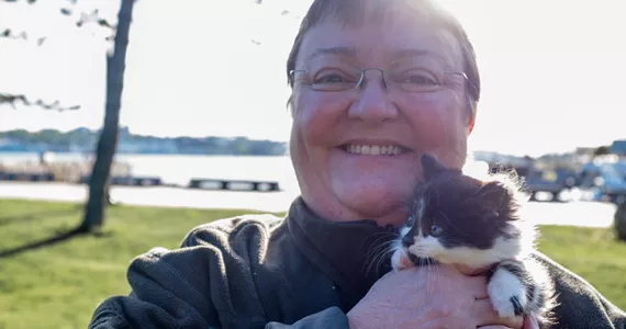 Volunteer Linda Felix with Micky: “A lot of people believe the city is dealing with these issues.” - SAMSON LEARN