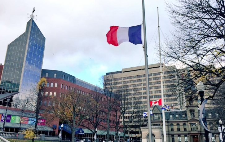 The French flag flies at half-mast in front of City Hall last week. - VIA MIKE SAVAGE