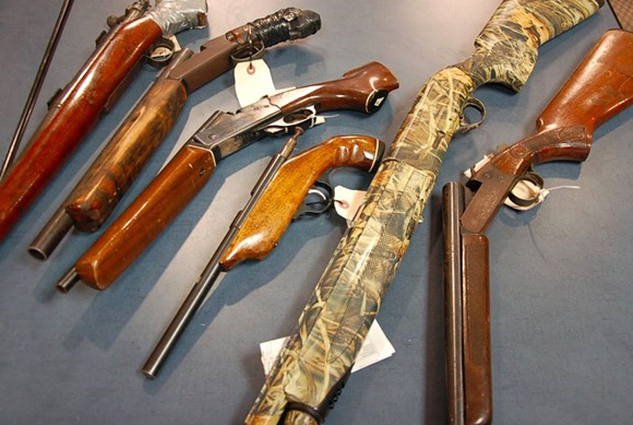 Assorted rifles and shotguns that have been confiscated by police. - THE COAST