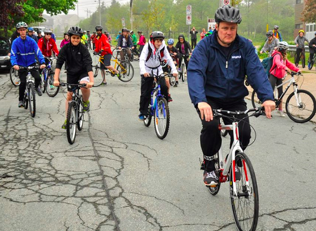 Mike Savage leading the pack on a drizzly mayor's bike ride on June 10. - VIA FACEBOOK