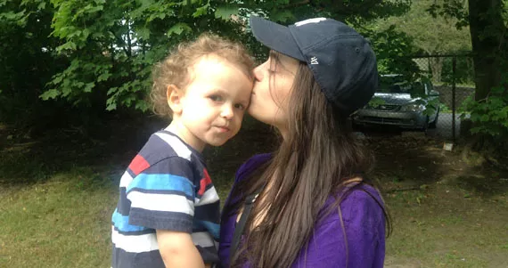 Twenty-five-year-old King’s College student Nicoletta Dini and her three-year-old son Luca on a break from school to check out the playground. - SARAH POKO