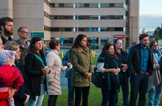 Jones (centre) leads protesters at the rally outside the Dartmouth General on Thursday evening. - KIERAN LEAVITT