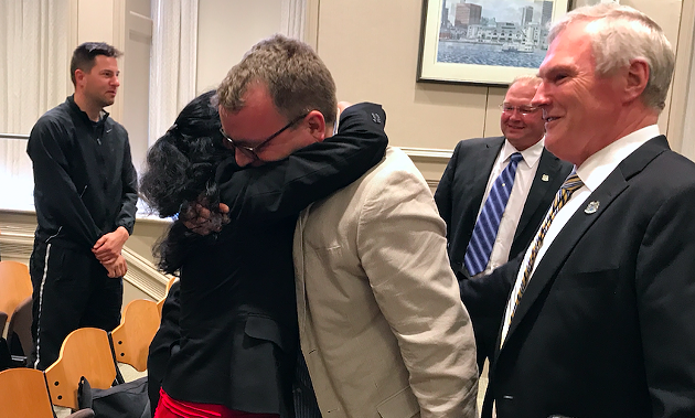 Councillor Waye Mason hugs Mi'kmaw Native Friendship Centre executive director Pam Glode-Desrochers - THE COAST