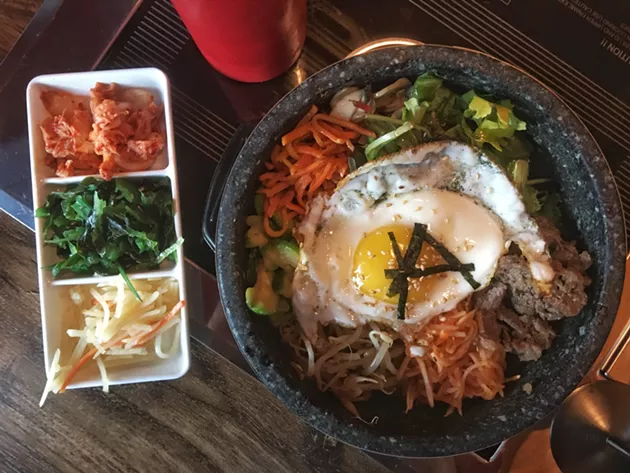 A banchan trio and hot stone bibimbap