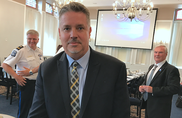 Scot Wortley, flanked by deputy chief Robin McNeil (left) and board of commissioners chair Steve Craig (right). - THE COAST